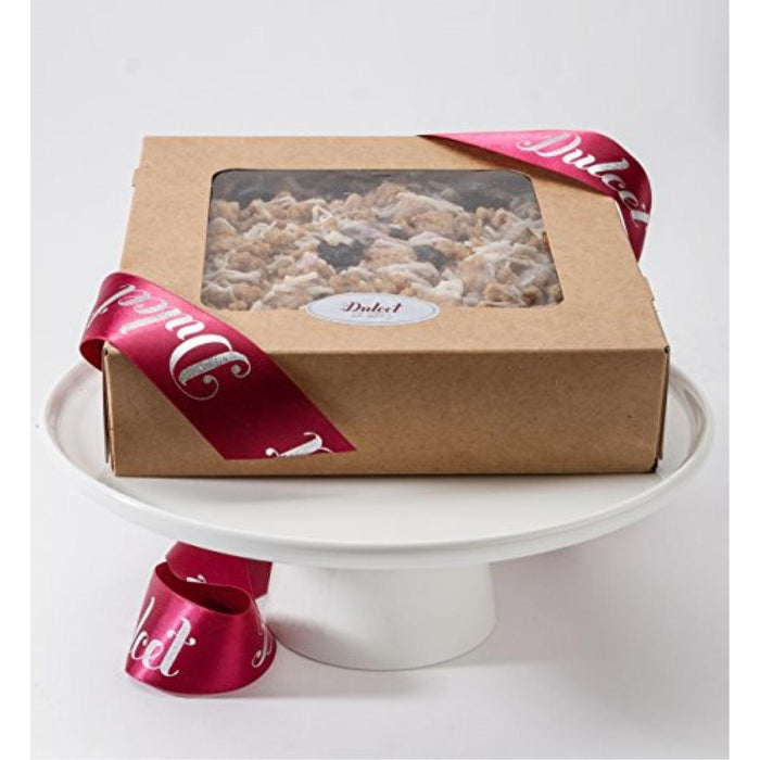 Brown gift box with clear window and shredded filling on a white pedestal