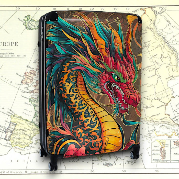 Black hard-shell suitcase with colorful fire dragon artwork on front panel, side view
