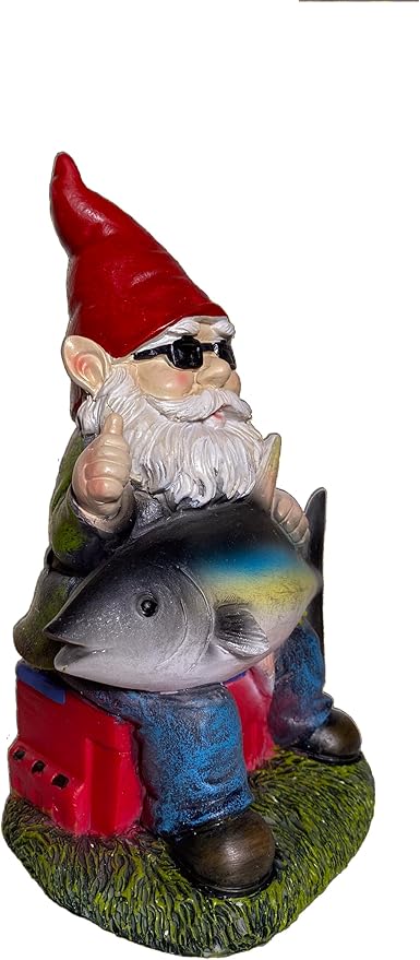 Fishing garden gnome statue with red hat holding tuna fish on green grass base
