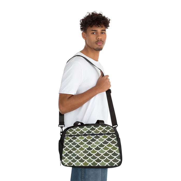 Crossbody fitness duffel bag on person, black trim with green-and-white scallop pattern