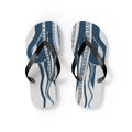 Pair of blue octopus-pattern flip-flops with black straps on light background