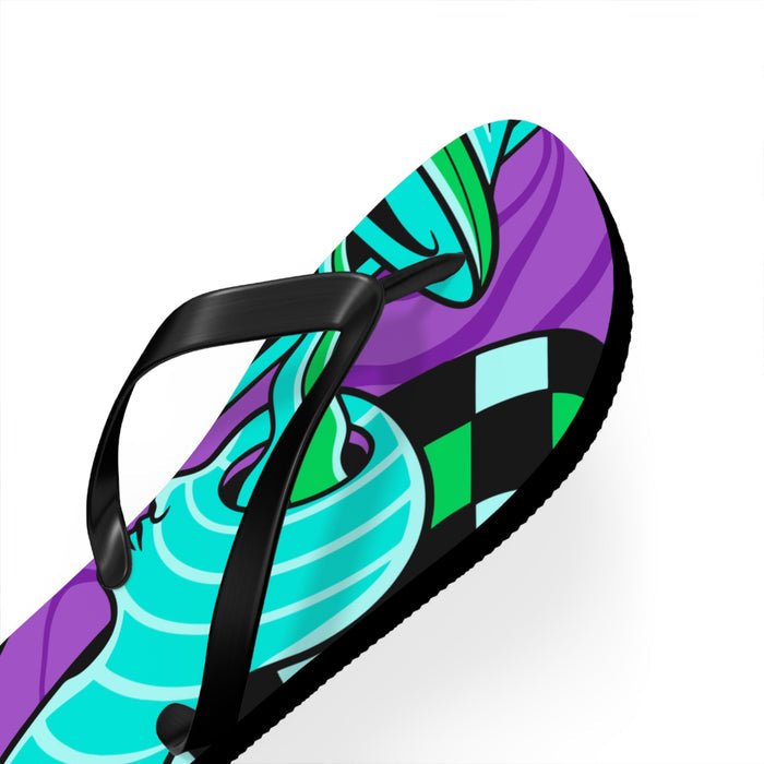 Close-up of teal and purple flip flop with black thong strap and patterned footbed