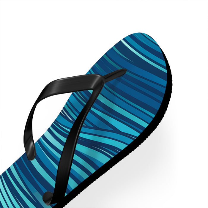 Close-up of blue ocean-wave flip flop with black thong straps