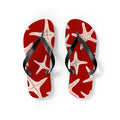 Red flip flops with white starfish print and black thong straps