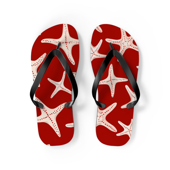 Red flip flops with white starfish print, black thong straps