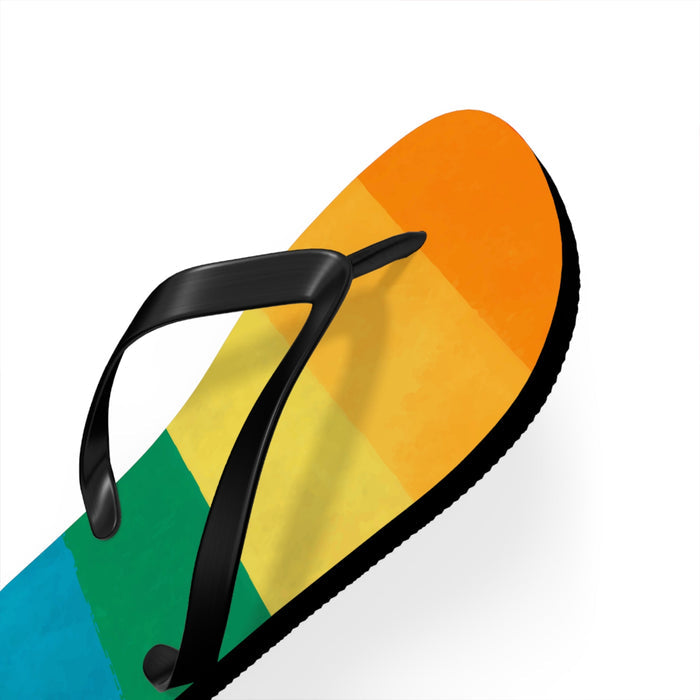 Strappy flip flop sandal showing side profile with rainbow stripe upper and black thong