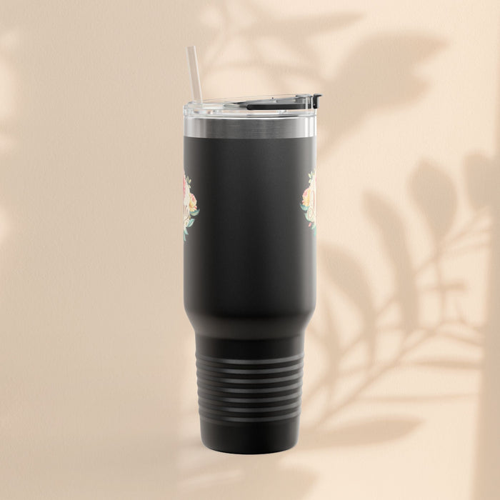 Black insulated travel mug with small floral accents near top, clear lid and straw