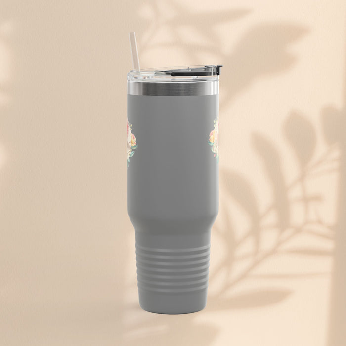 Gray insulated travel mug with small floral accents near top, clear lid and straw