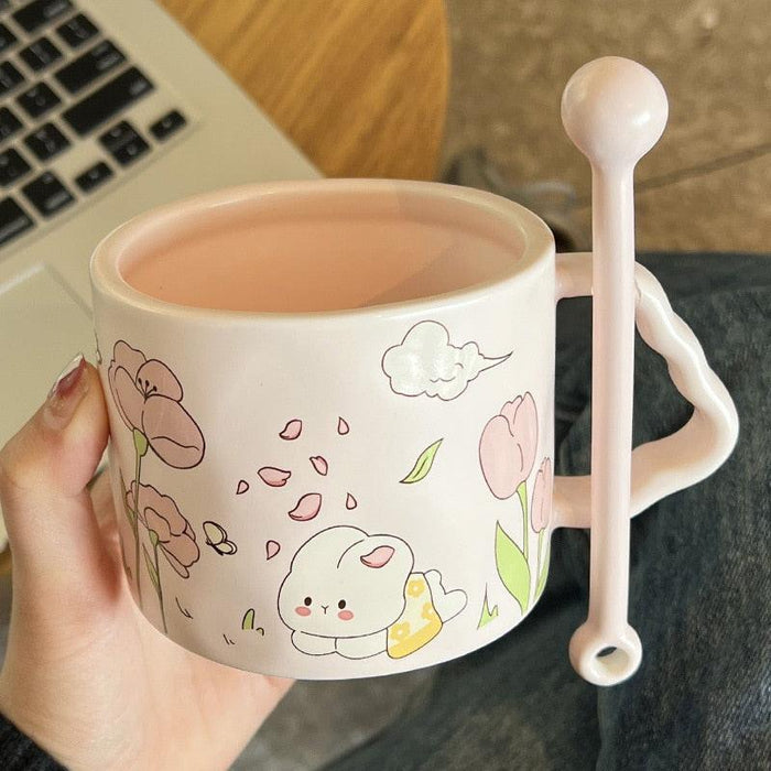 White bunny flower mug with pink tulip and berry illustrations, plus spoon-shaped handle