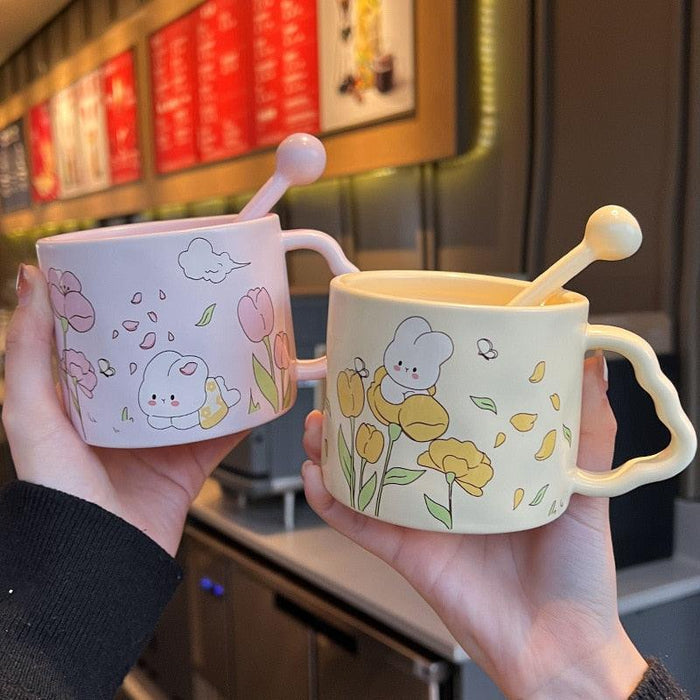 White bunny flower mug set in two designs, each with a spoon-shaped handle