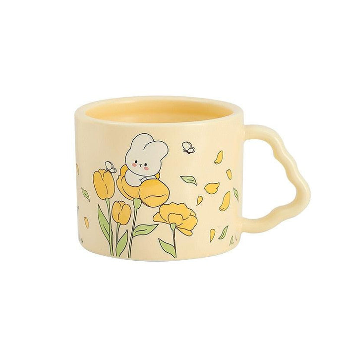 Cream bunny flower mug with yellow tulip design and a spoon-shaped handle