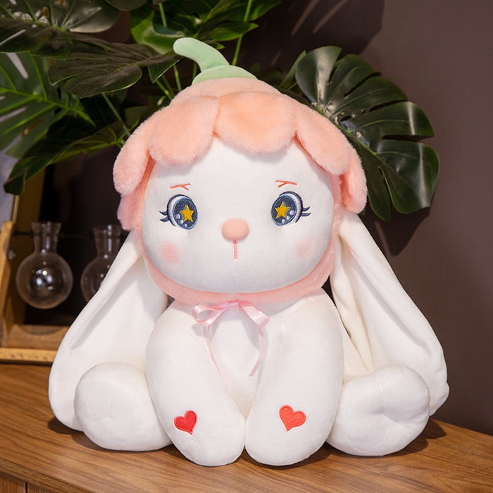 Flower bunny plushie with green ears, blue star eyes, pink bow, and heart accents