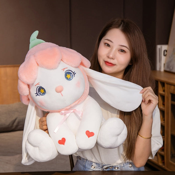 Flower bunny plushie with green ears, blue star eyes, pink bow ribbon, and heart details