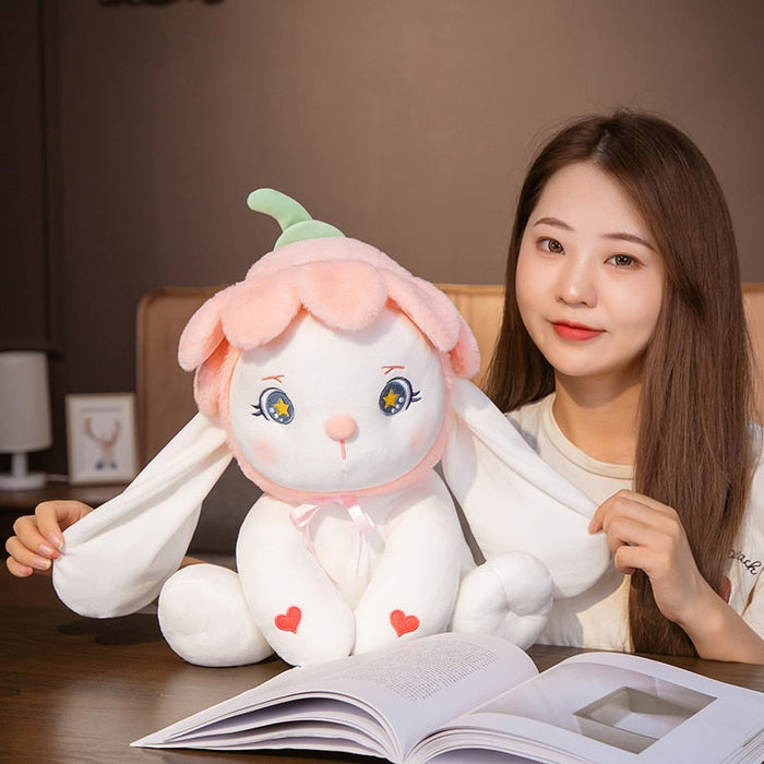 Flower bunny plushie with green ears, blue star eyes, pink bow, heart patches, and soft ears