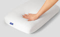 A hand feeling the Casper Foam Pillow with Snow Technology