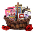 Gift basket with wrapped treats, chocolate snacks, and red roses in a wicker basket