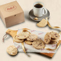 Assorted cookie gift box with mixed cookies, cardboard box and ribbon