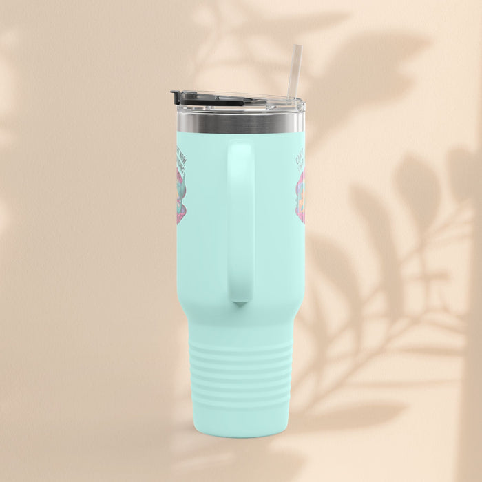 Light teal insulated travel mug with lid and straw, ribbed grip section on body
