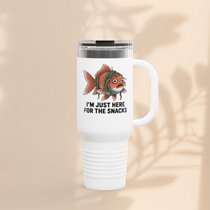 White insulated travel tumbler with fish graphic and “I’m just here for the snacks”