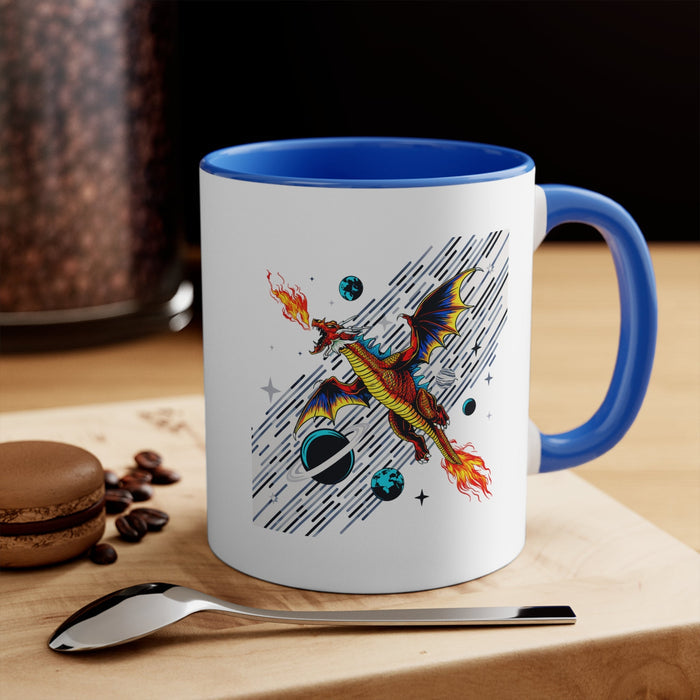 Blue-handled white mug with space dragon artwork, planet icons, and streak background