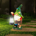 Green garden gnome resin statue holding a solar lantern and welcome sign