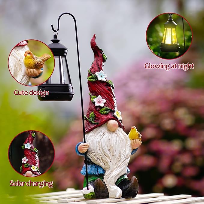 Solar gnome holding lantern stake with floral red hat and white beard, holding a bird