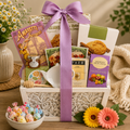 Gourmet gift basket with purple bow, tea and assorted cookies in a white tray