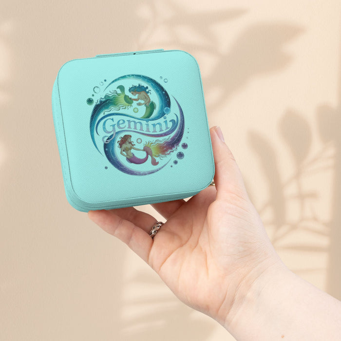 Light blue zippered jewelry travel case with Gemini zodiac graphic on front.