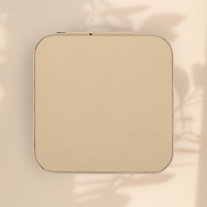 Ivory zippered jewelry travel case with smooth front panel.