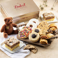Dulcet gift tin with assorted pastries and cookies, plus a small plush teddy bear