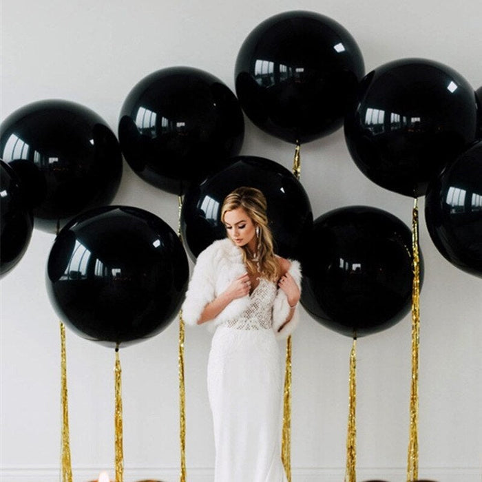 Set of black giant balloons with gold strings and glossy finish