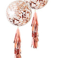 Giant rose gold confetti balloon with pink tassel tail and matching balloon knot