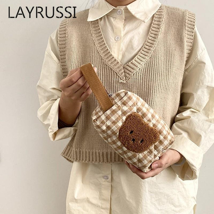 Gingham teddy bear cosmetics bag held with detachable shoulder strap