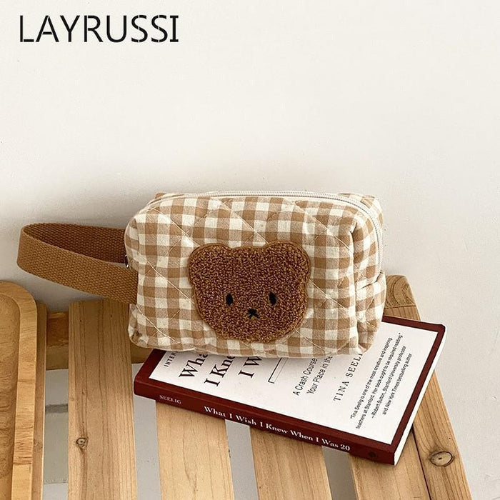 Gingham teddy bear cosmetics bag with brown bear face patch on front