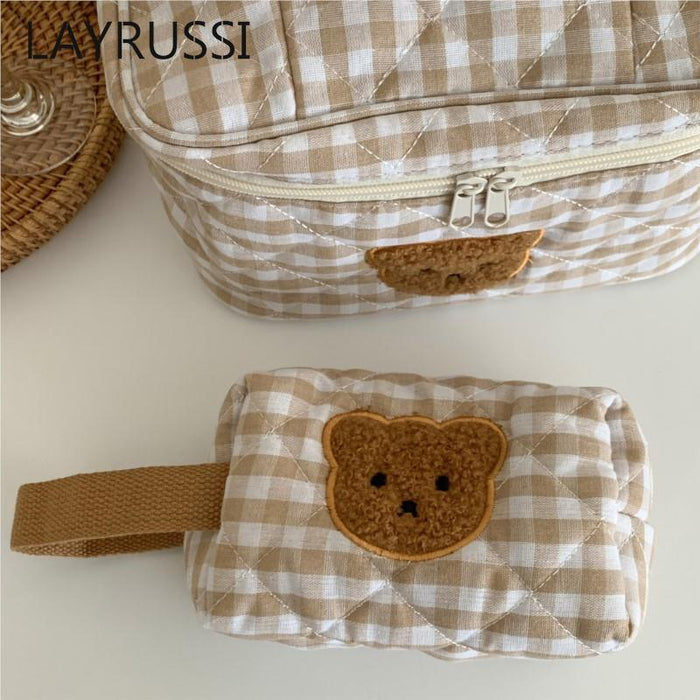 Gingham teddy bear cosmetics bag detail of front zipper and brown bear patch