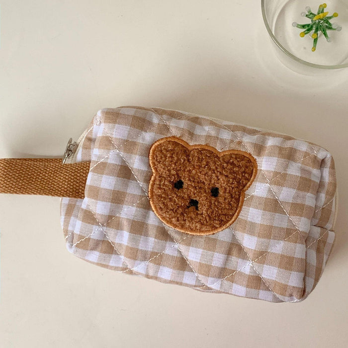 Gingham teddy bear cosmetics bag with brown bear face applique on side
