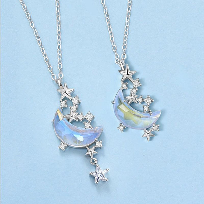 Moon pendant necklace with glazed blue crescent and dangling star charms