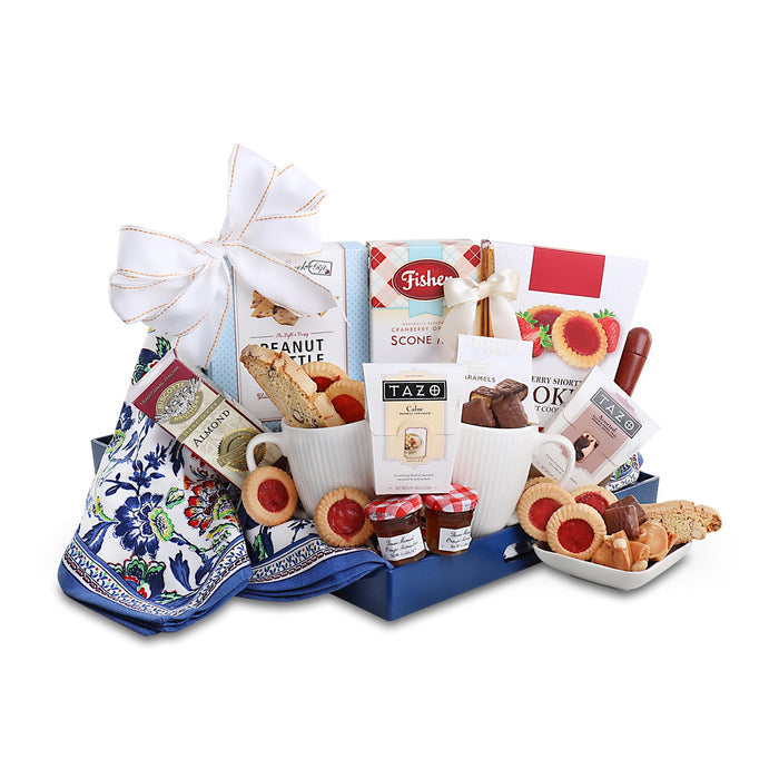 Breakfast tray gift basket with blue base, patterned napkin, mugs, and assorted treats