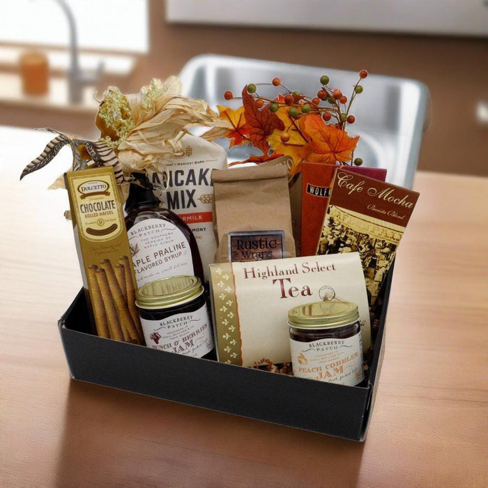 Breakfast gift box tray with chocolate pancake mix, tea, praliné, and assorted jars