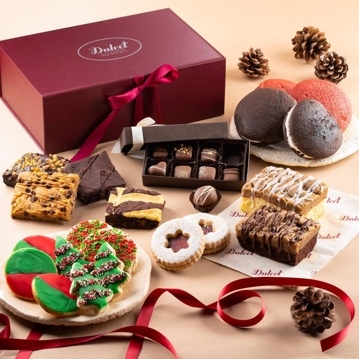 Holiday treat gift box with maroon lid, magenta ribbon, and assorted cookies