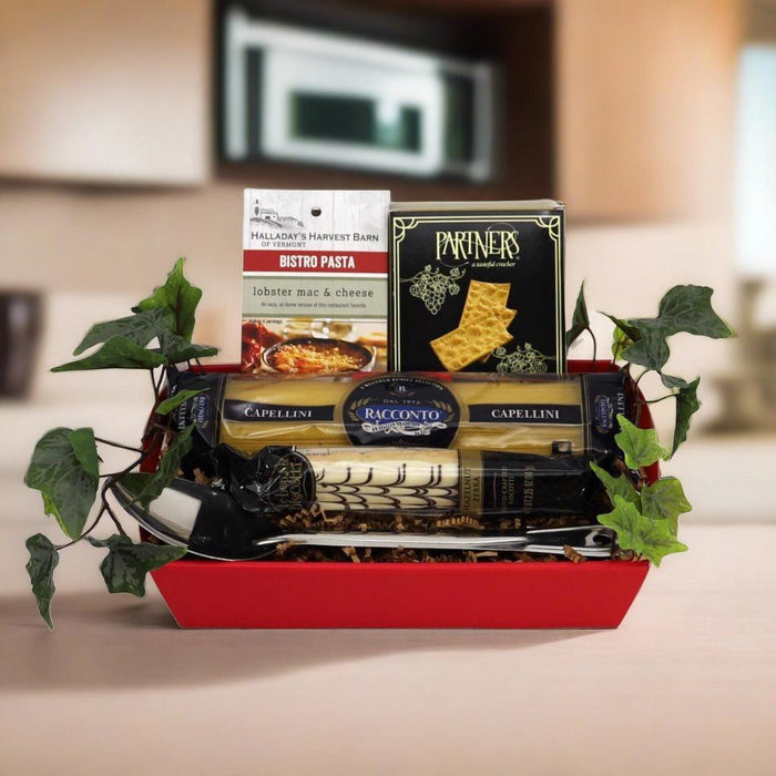 Red Italian gift basket with stacked pasta and sauce boxes