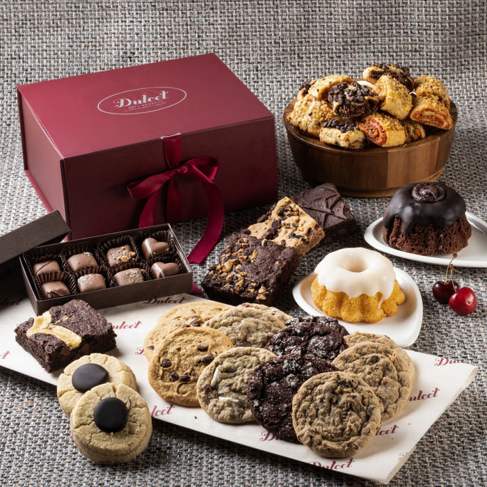 Gift basket with assorted cookies, brownies, and pastries in a maroon box and tray