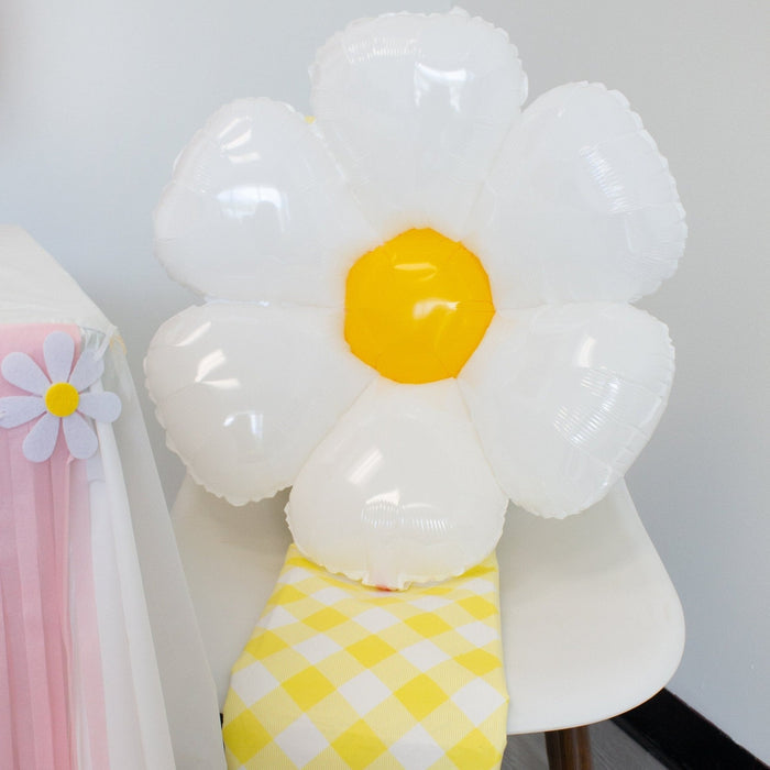 White daisy foil balloon with yellow center and gingham band, small table décor