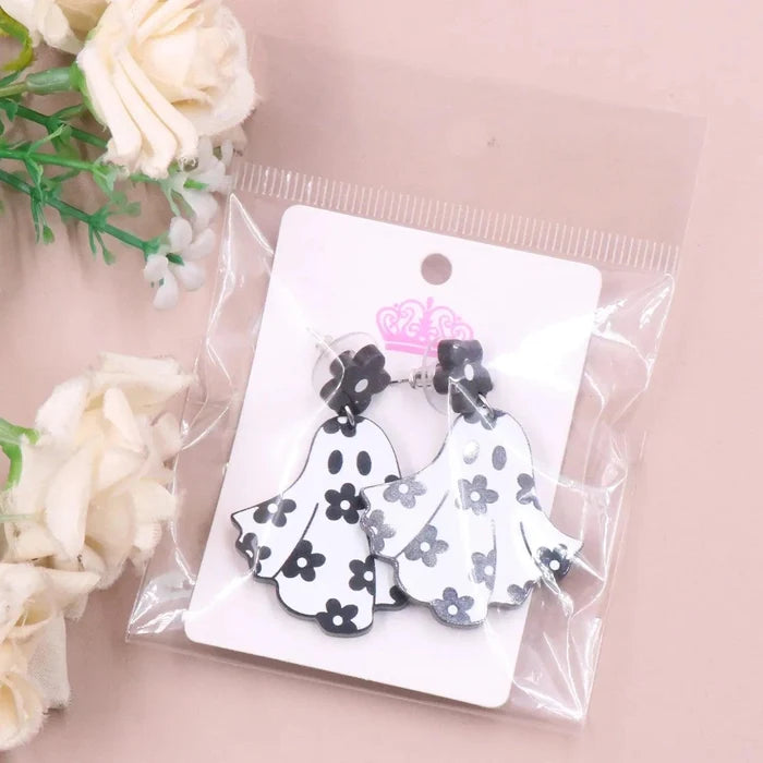 Ghost earrings in clear bag: white ghost charms with black flower and dot pattern