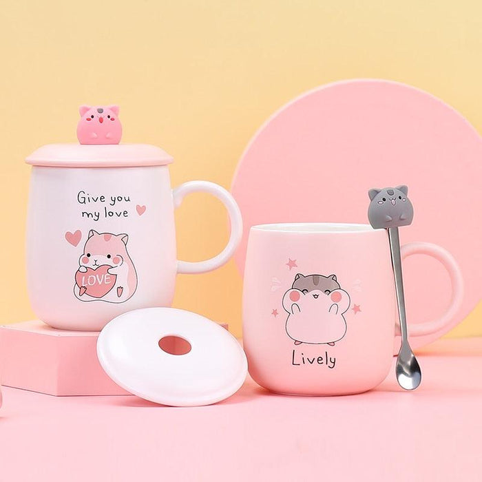 Pink hamster-themed ceramic mug with lid, front love-heart design, matching handle