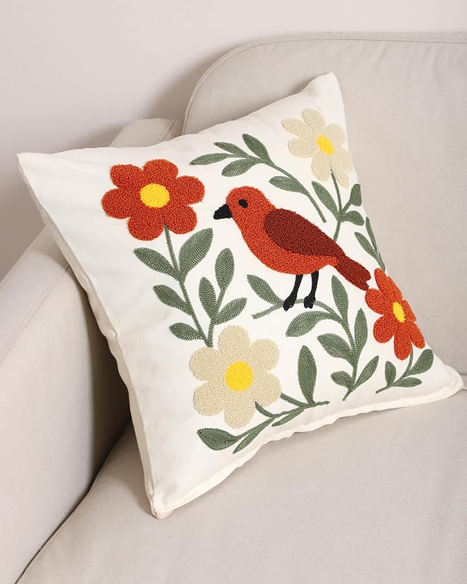 Bird embroidered throw pillow cover showing red-orange bird among green leaves