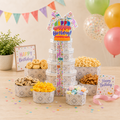 Birthday treat gift tower with stacked patterned boxes and colorful ribbon, Happy Birthday topper