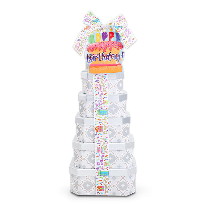 Birthday treat gift tower with tall stacked gray patterned boxes and Happy Birthday topper