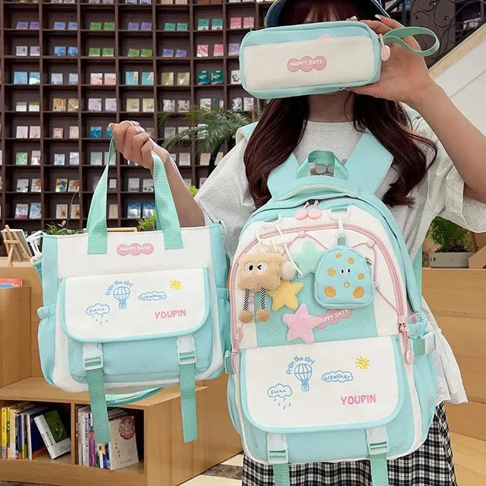 Mint 3-piece backpack set with cartoon backpack, zip pouch, and matching tote bag.