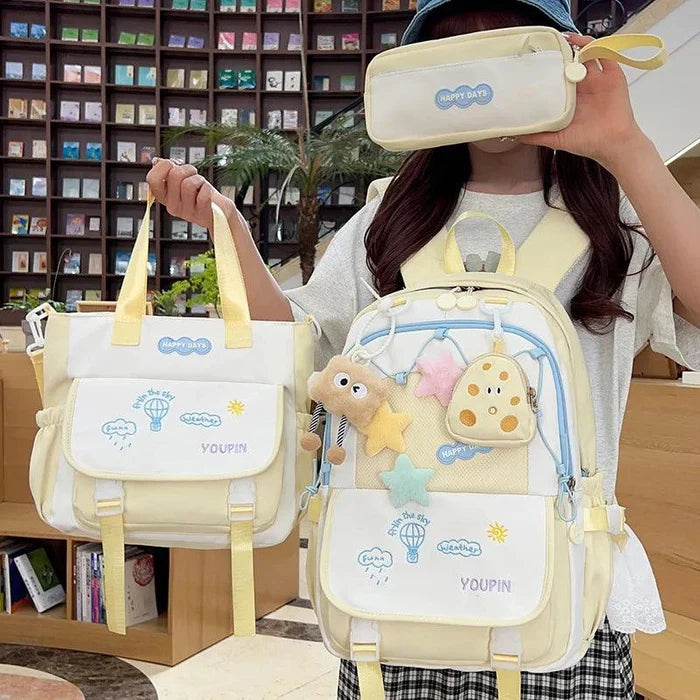Yellow 3-piece backpack set with character backpack, matching tote bag, and zip pouch.